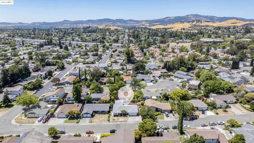 Aerial view of residential area with a mountain backdrop