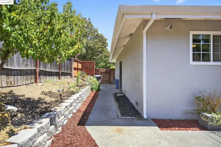 View of side of home with stucco siding