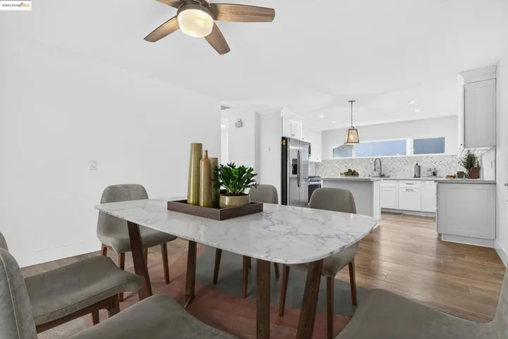 Dining room featuring ceiling fan, light wood finished floors, and recessed lighting