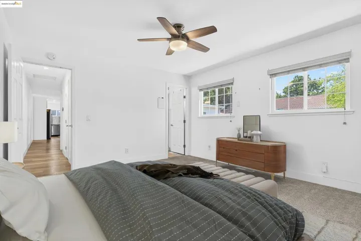 Bedroom featuring baseboards and ceiling fan