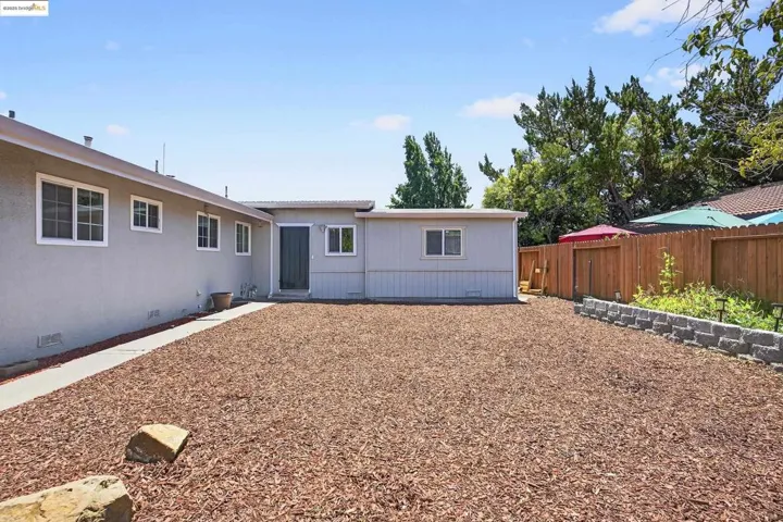 Rear view of house with crawl space