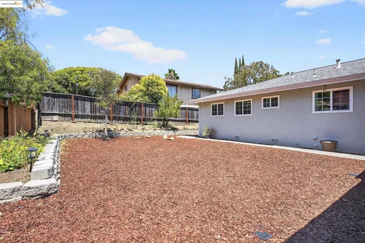View of fenced backyard