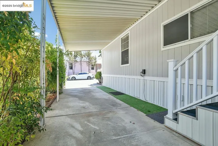 View of patio featuring an attached carport