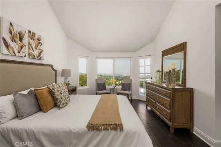 Serene Primary Suite with Vaulted Ceilings and Breathtaking City Views