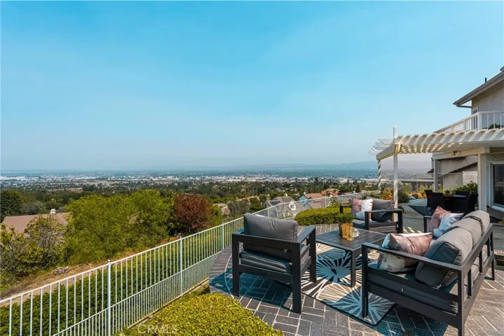 Sweeping Backyard Panorama with Tiered Landscaping and Endless View