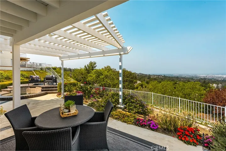 Lush Garden Patio with Pergola and Sweeping City-to-Ocean Views