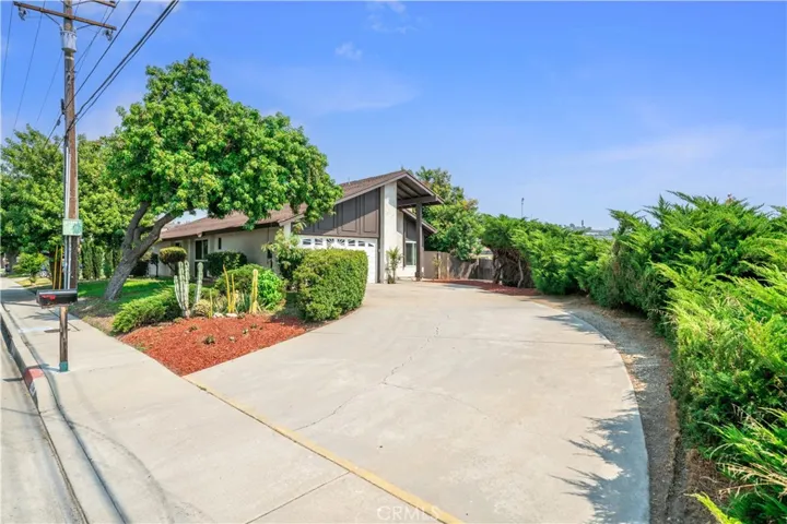 Set back with a long private driveway, this Walnut home offers both privacy and curb appeal with lush greenery and manicured landscaping.