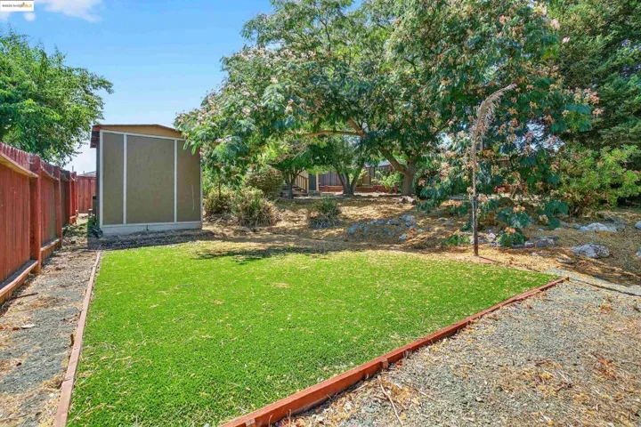 View of yard featuring a sunroom