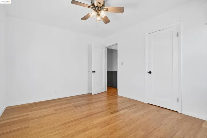 Unfurnished bedroom with light wood-style flooring and a ceiling fan