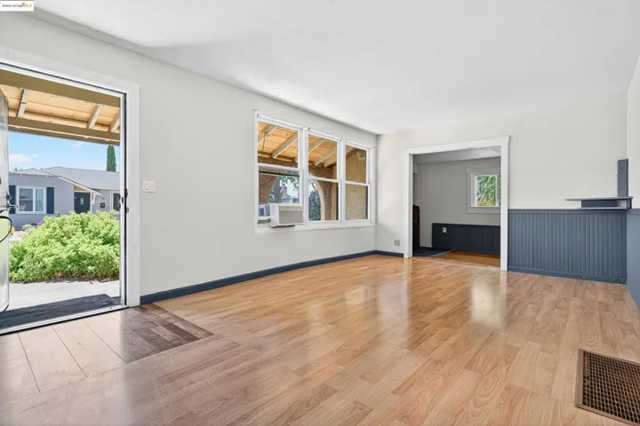 Unfurnished living room with light wood-style flooring