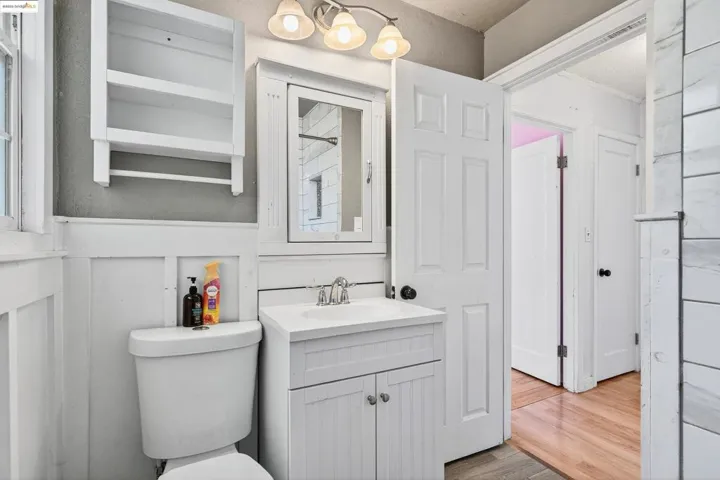 Bathroom featuring vanity and wood finished floors