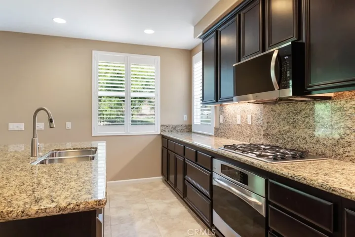 Kitchen with stainless steel appliances.