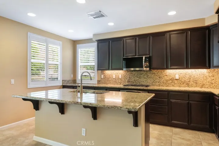 Granite counter tops with island.