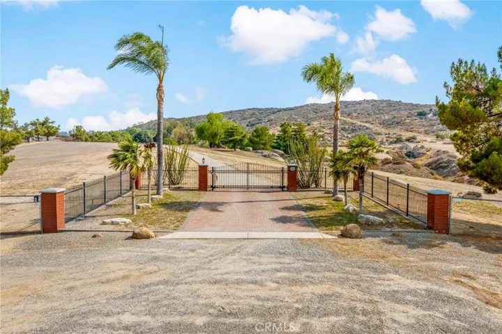 Front entrance w electronic gate.
