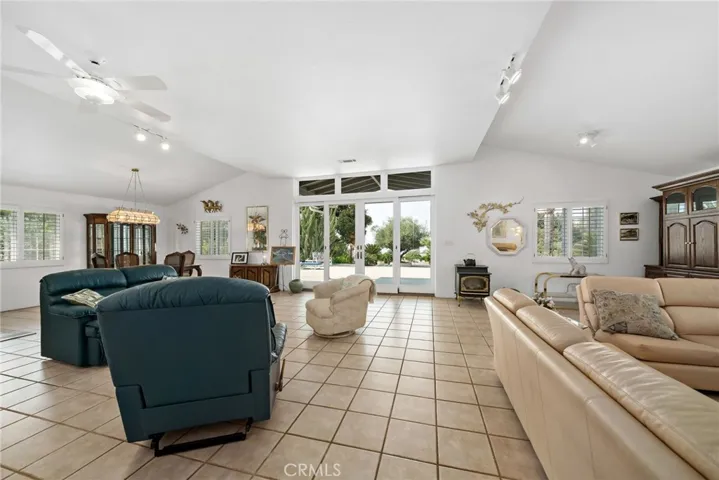 Grand great room w pellet stove to the right of glass sliding doors