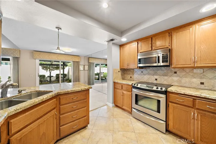 Additional Features Include Raised Panel Interior Doors, a Half Bath Downstairs, and the Garage has Built-In Cabinetry and a Work Bench. It Needs a Tiny Bit of Updating but what a Perfect Place to Decorate and Make it Your Own Dream Home!