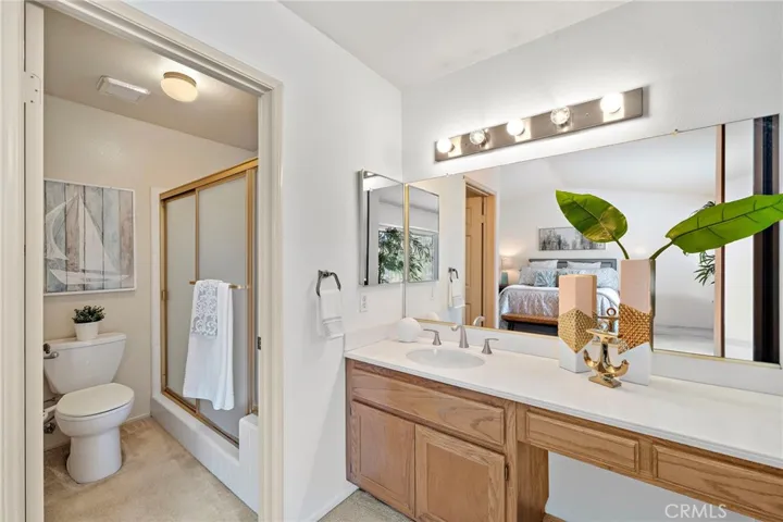 This Popular Model Boasts 2 Large Primary Suites, Each Showcases Vaulted Ceilings, Two Mirrored Closets, and Private Ensuite Bathrooms with Sit-Down Vanities.