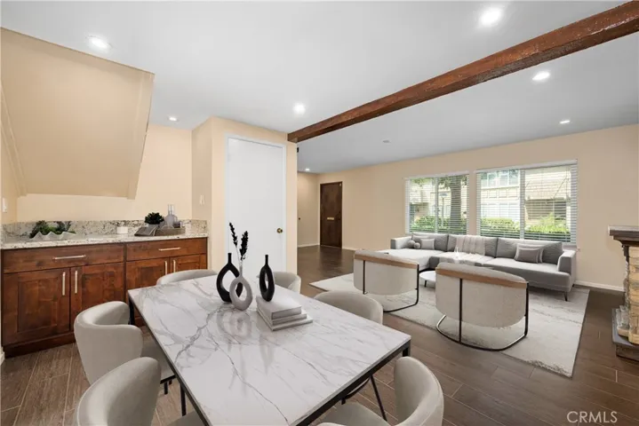 Virtually staged dining and living room, take note of the dedicated Coffee Station in the background. Coffee station features Granite Countertop nicely appointed cabinets that provide a good amount of storage space.