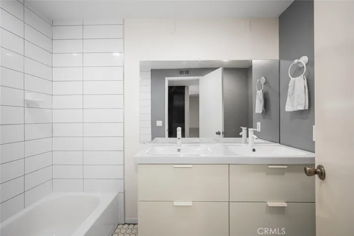 Upstairs Hallway Bathroom, showing upgraded dual sinks.