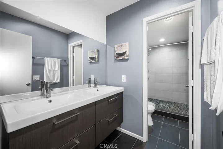 Master Bathroom features integrated ceramic wash basin with dual sinks that offers a flawless look with smooth lines. The European Style cabinet offers stylish pullout drawers that offer lots of storage.