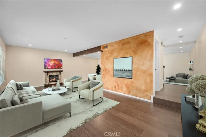 Virtually staged living room, Electric remote controlled fireplace is included with the home, recessed lighting and smooth ceilings throughout.