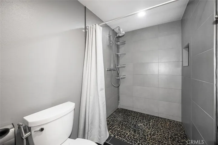 The oversized shower has also been nicely upgrades with new tile walls and flooring.