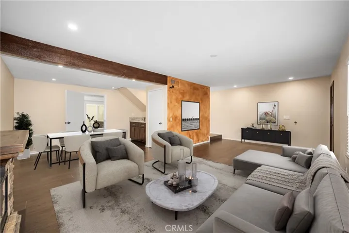 Virtually staged main living and dining areas. Tasteful wood like plank tile flooring installed throughout the entire downstairs