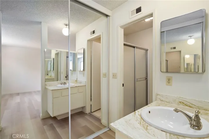 Primary Bath with mirrored closet doors