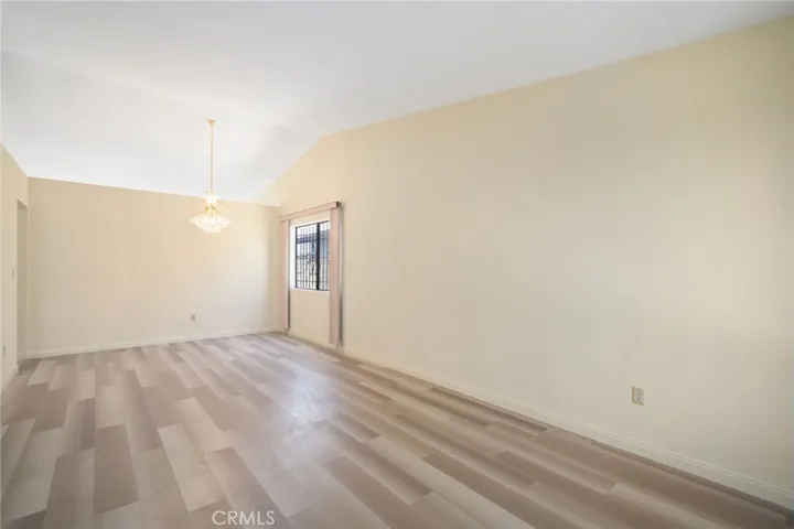 **without virtual staging ** another angle of the formal living and dining room with High Ceilings and Newer Flooring