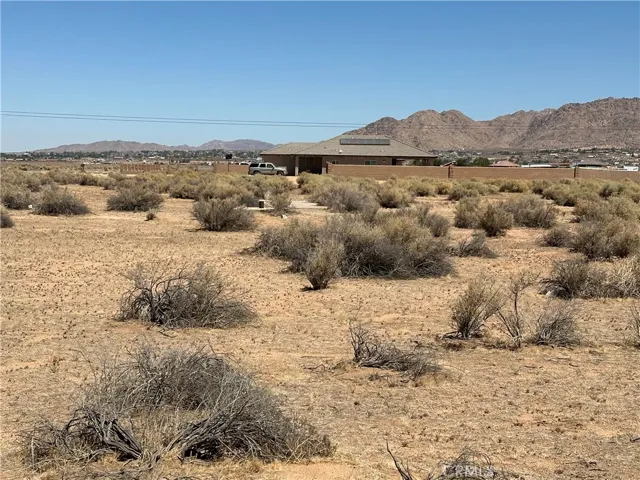 Northern view of lot showing neighboring vacant lot before Ramona Avenue.