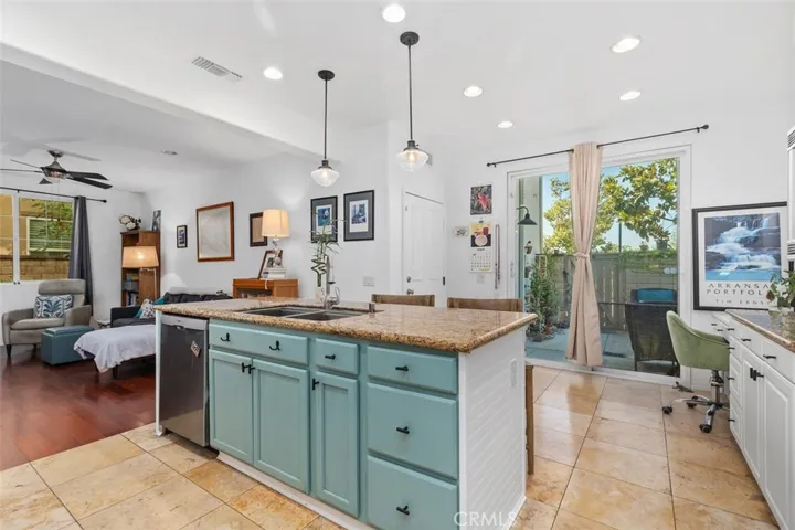 Kitchen showing island and access to patio.