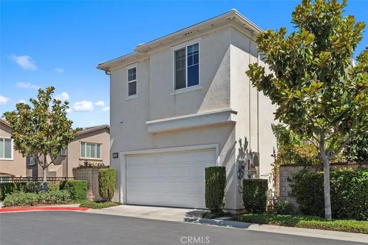 2 car garage is across from guest parking spaces.