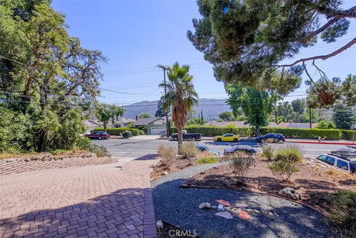 View of driveway and front yard from house