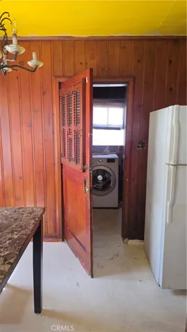Kitchen Dining area with view of laundry room