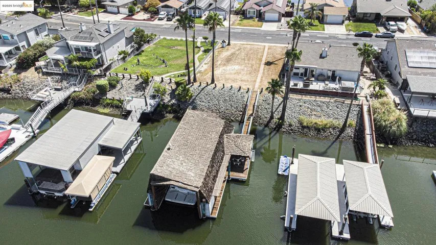 Aerial view of residential area with a large body of water