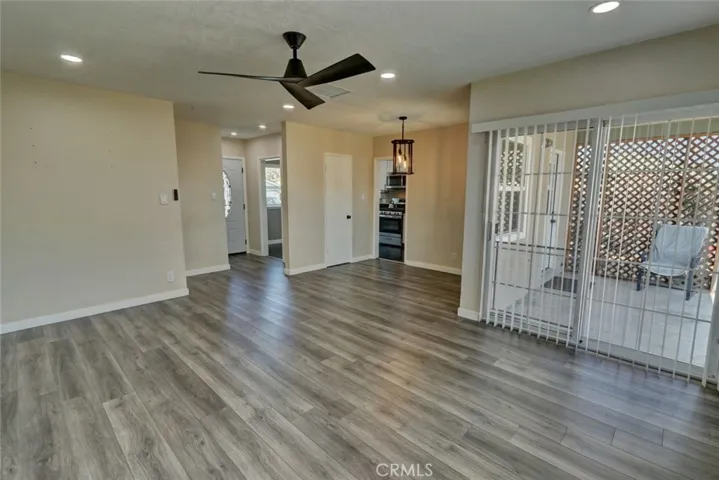 Sliding doors from living room open to covered patio area