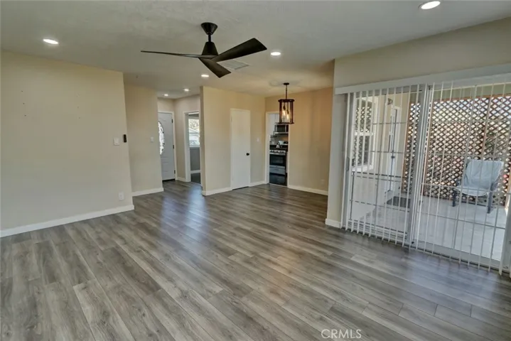 House has modern vinyl floor and scraped ceilings.
