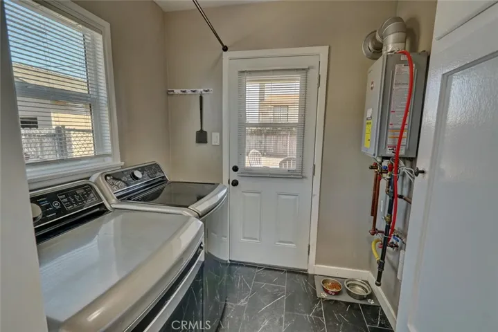 Separate laundry area. Tankless hot water heated installed 2023