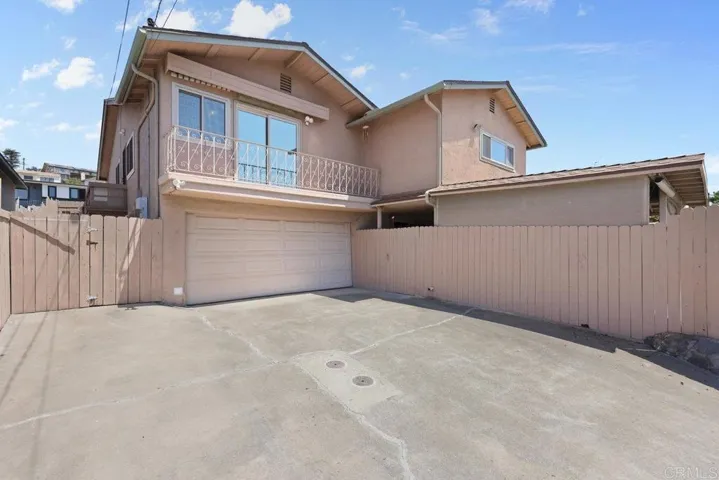 Alley view of garage and Basement