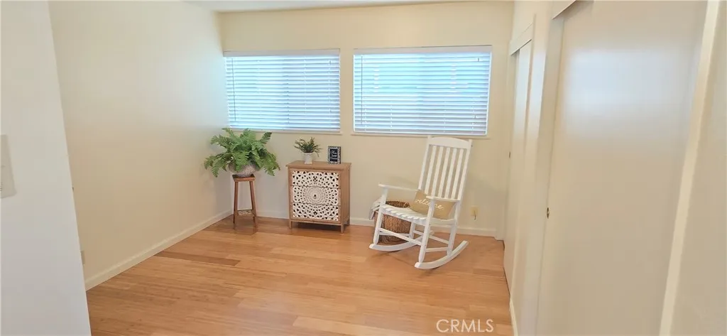 Primary bedroom has long wall of closets