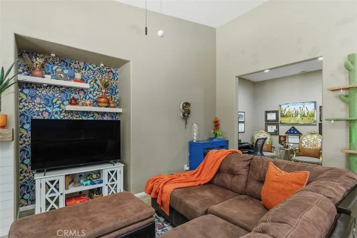 TV niche area with a closer view of the den entrance.