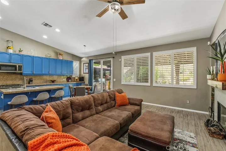 Full view of the family room opening into the kitchen area.