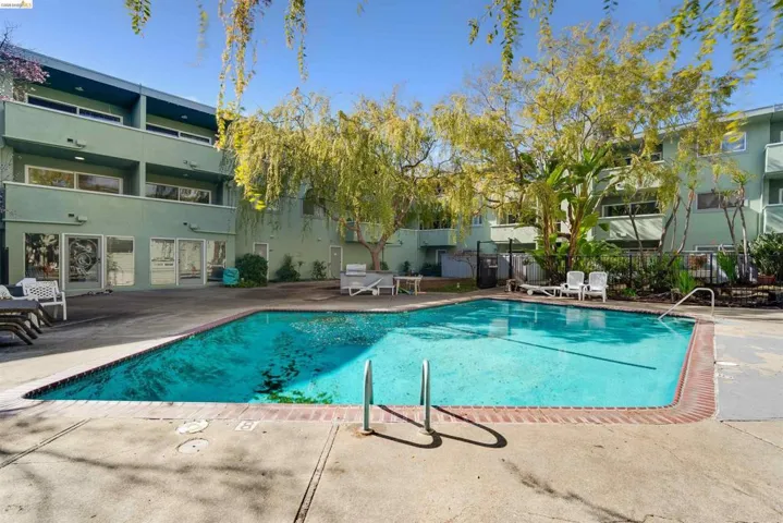 Community pool with a patio area