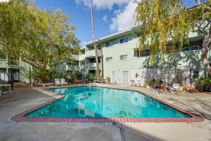 Community pool with a patio area