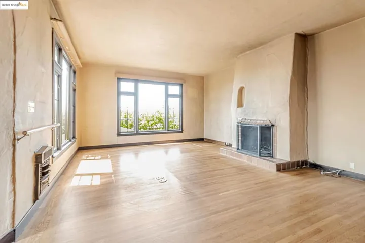 Unfurnished living room featuring a fireplace and light wood finished floors