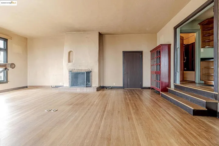 Unfurnished living room with light wood-style floors and a fireplace