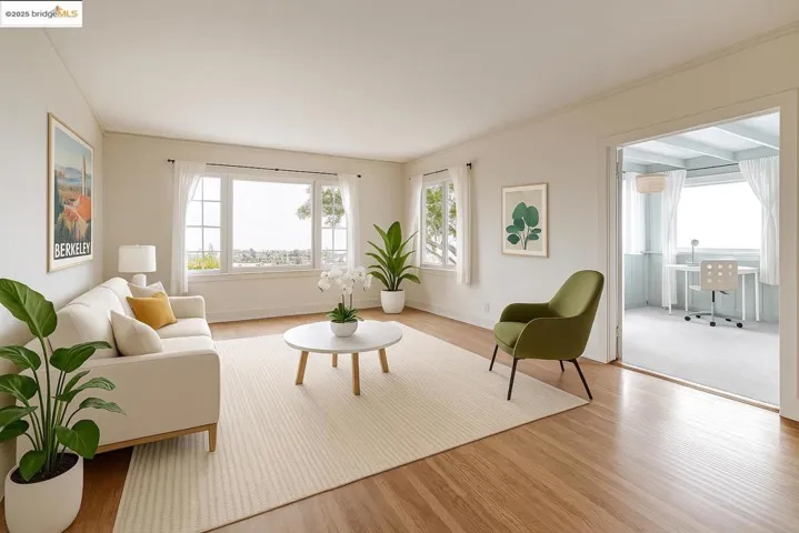 Living area featuring wood finished floors and ornamental molding
