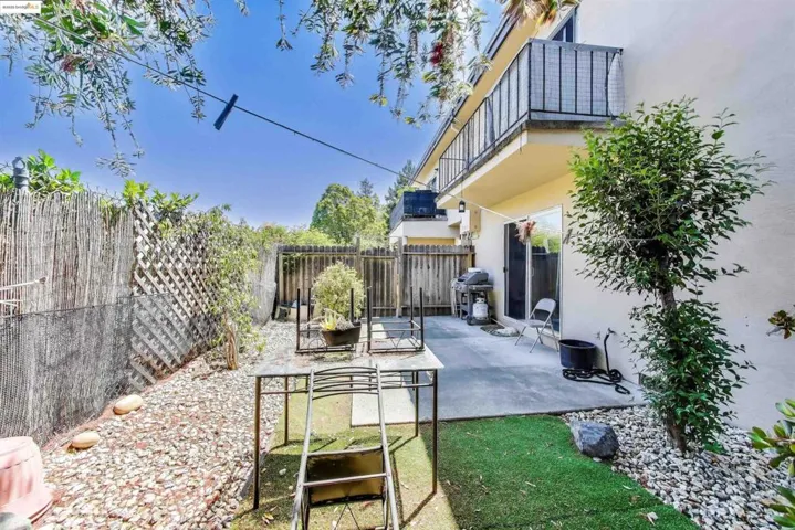 Patio / terrace with a fenced backyard, a patio area, and grilling area