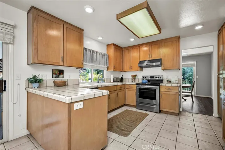 Spacious kitchen with stainless steel appliances & a plenty of cabinetry