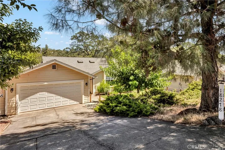 Downsloping driveway with extra parking pad at the top